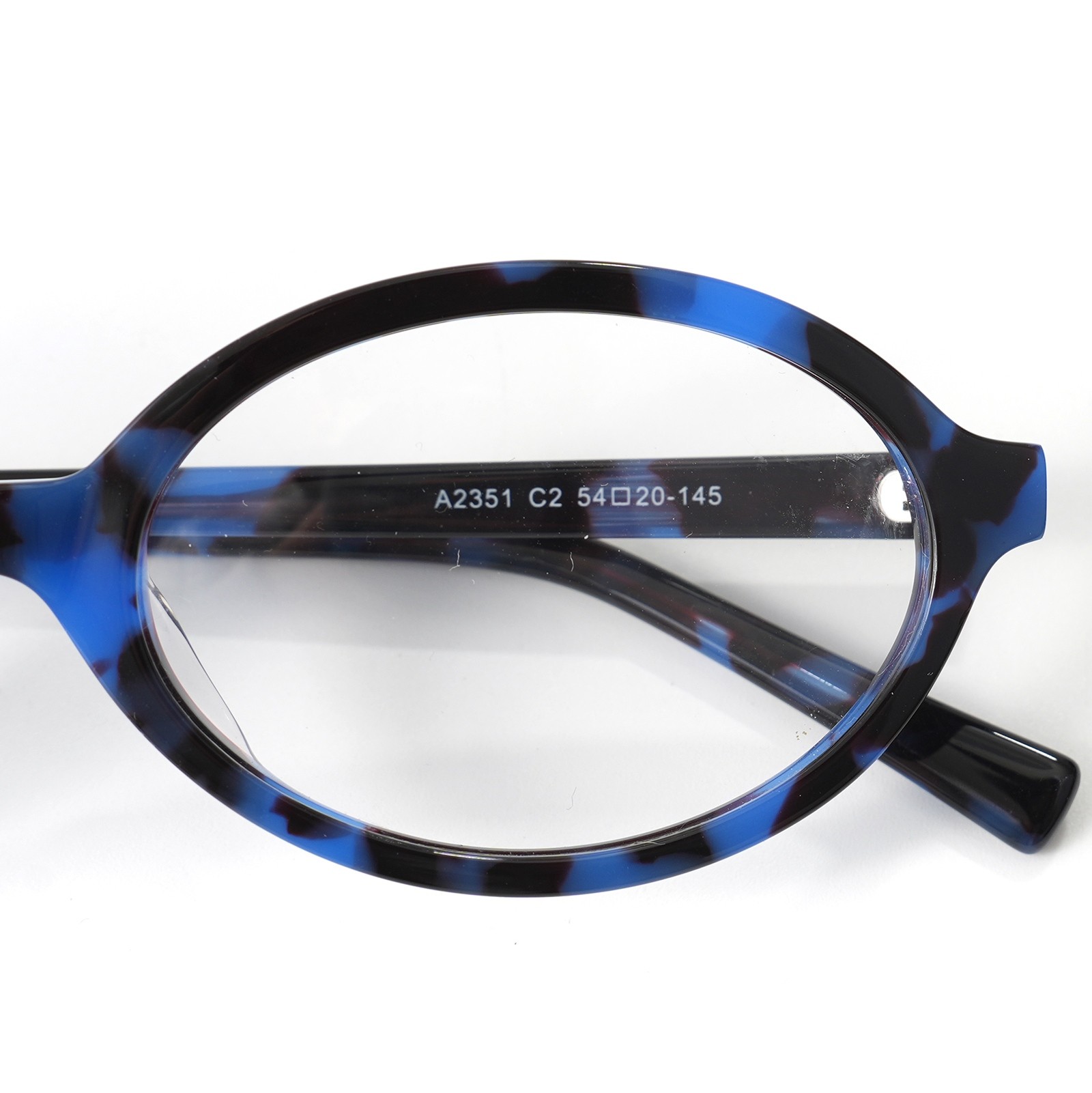 Close-up of custom eyeglass frame detail showing hinge and temple