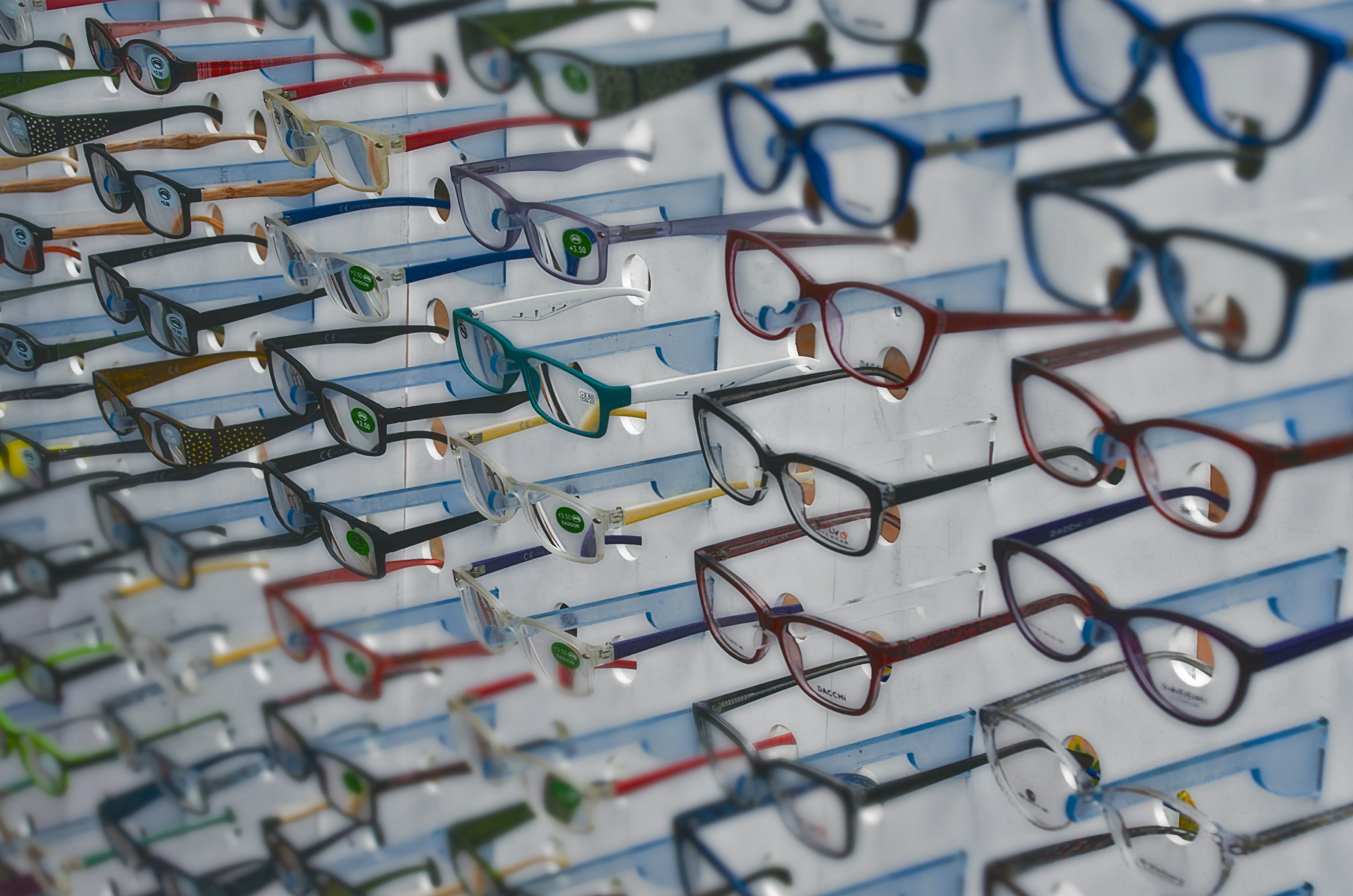 A collection of colorful cat-eye, aviator, and retro acetate optical frames