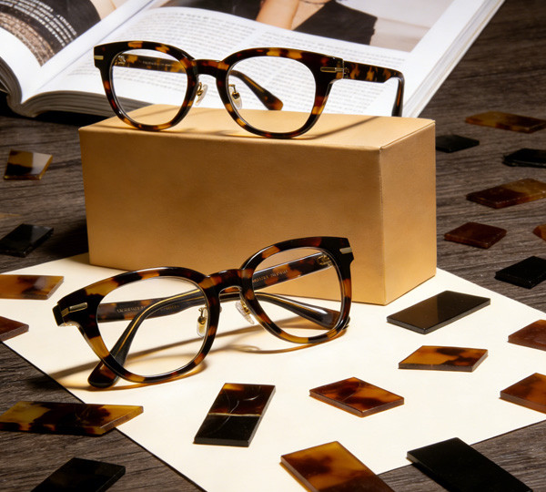 Sheet acetate eyeglass frame with a tortoise pattern running through the material