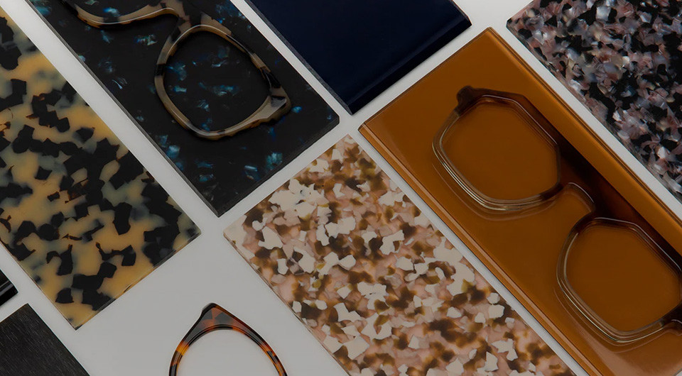 Acetate sheets in tortoise, honey and speckled patterns arranged with finished frames