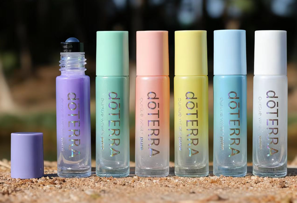 Automatic screen printing machine printing designs on cosmetic bottles in a modern factory