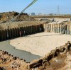 Steel sheet pile walls are constructed by driving steel sheets into a slope or excavation.