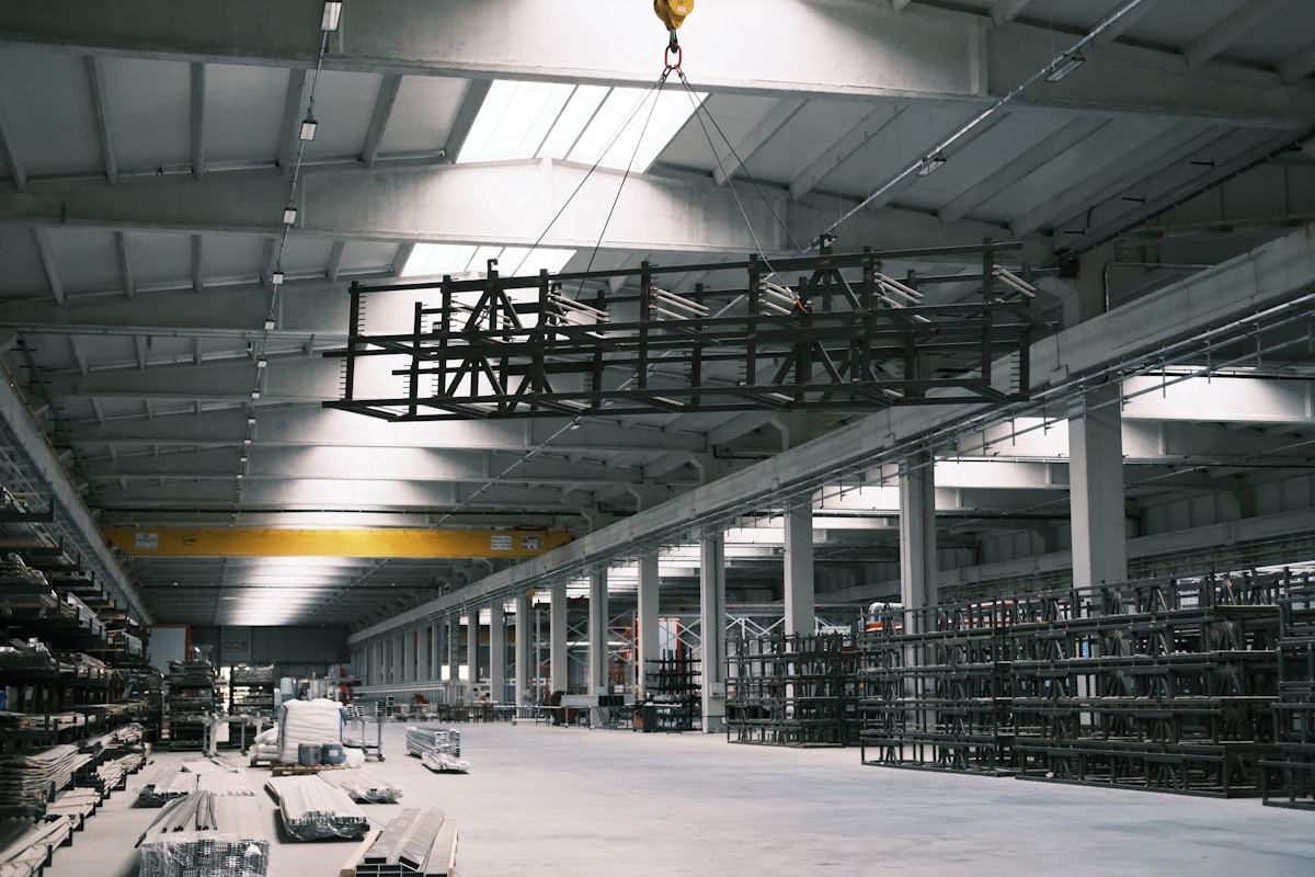 Industrial steel warehouse interior with racking and logistics layout