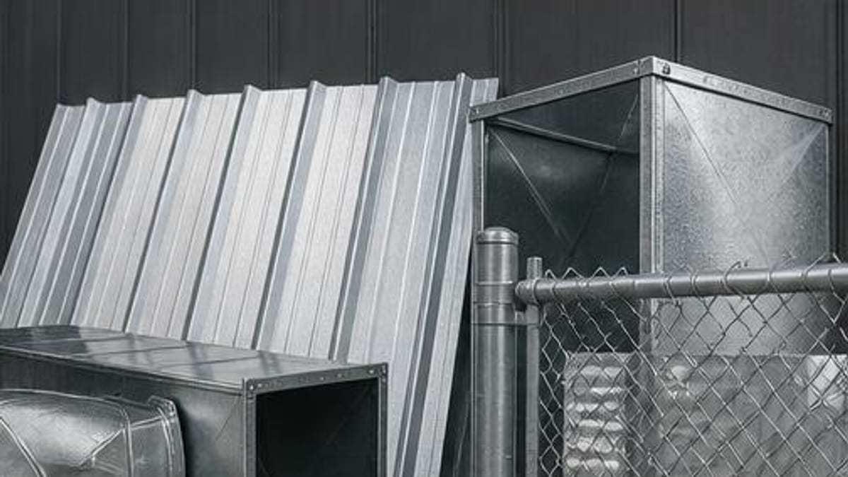 Galvanized roofing, ductwork and fencing samples in a materials selection setting