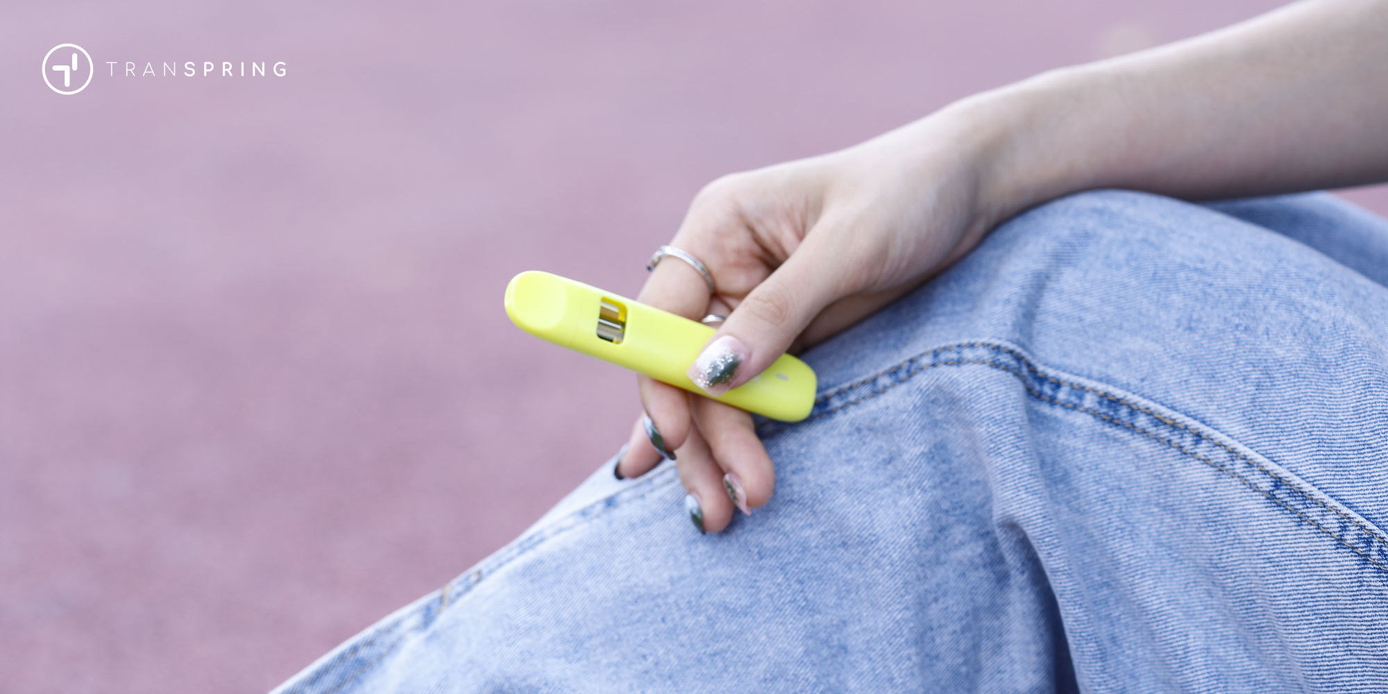 Disposable vape held in hand, representing the new majority format in U.S. cannabis
