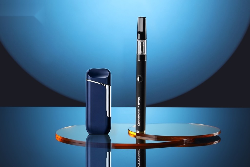 Transpring CannaMate premium vape devices on blue gradient background