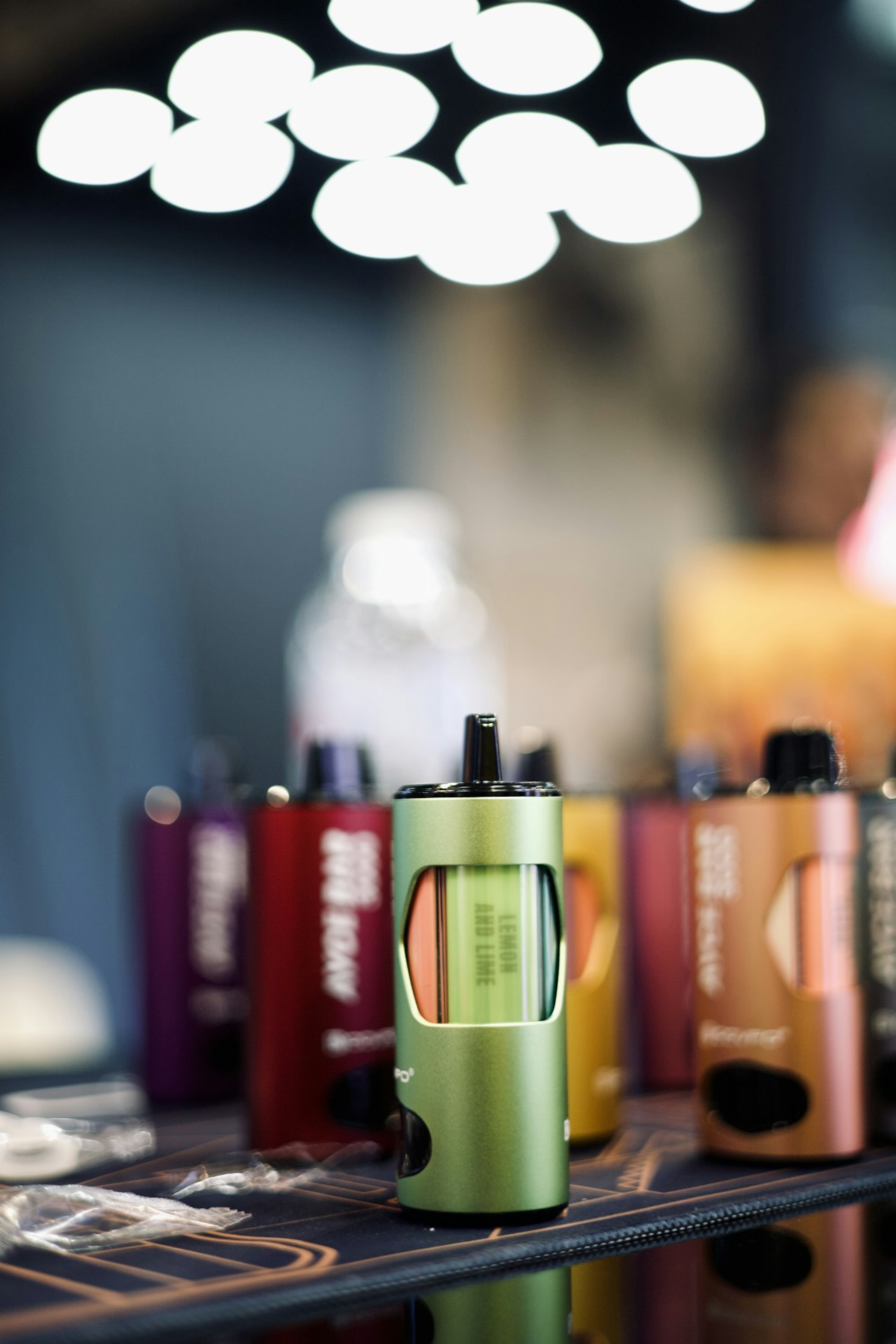 Group of rechargeable vape devices arranged on a table, matched with heating systems and batteries