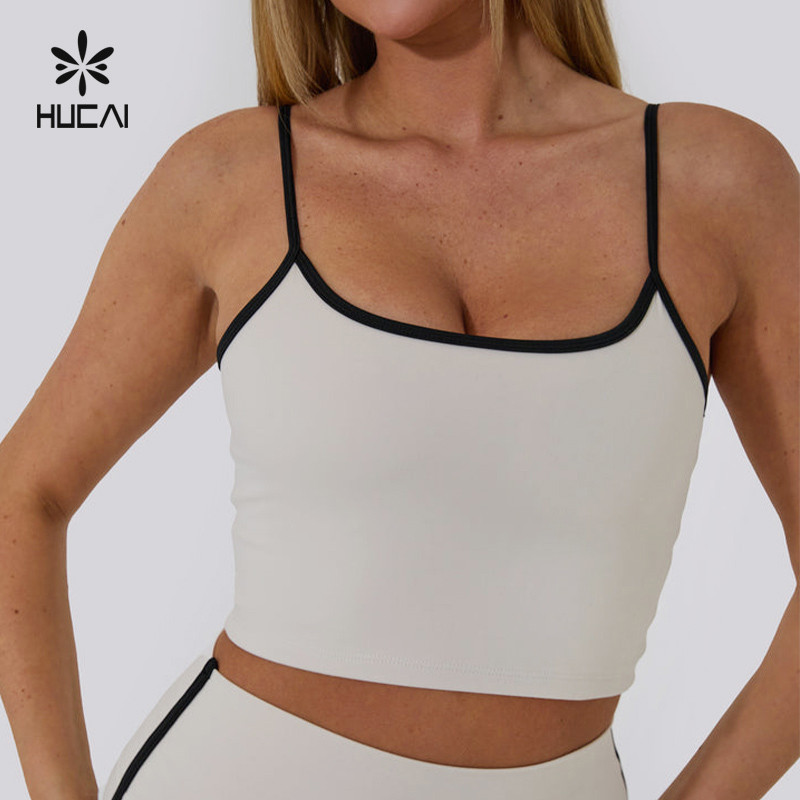 Cropped base layer top in a light knit with contrast bound edge finishing on the neckline
