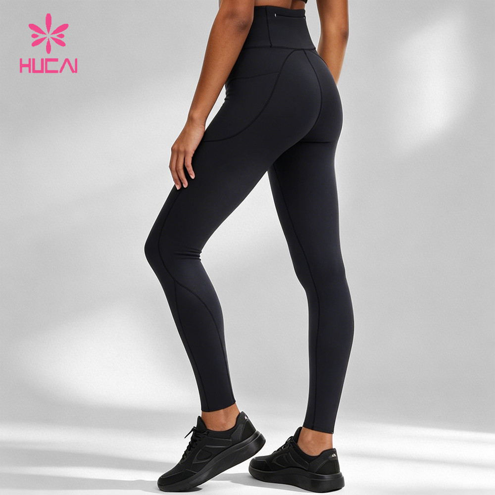 Women's black high-waist training leggings with contour seam detail