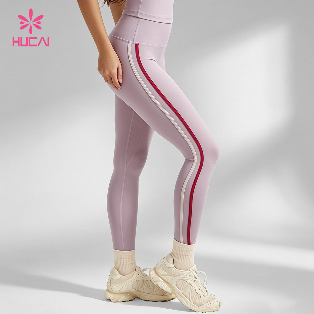 Women's light purple training leggings with contrast side stripes