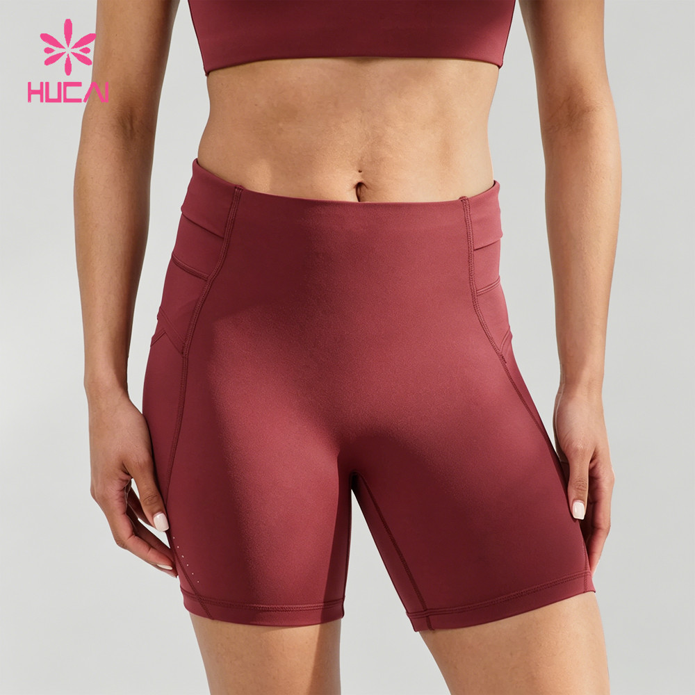 Women's burgundy high-waist compression shorts with side and hidden pockets