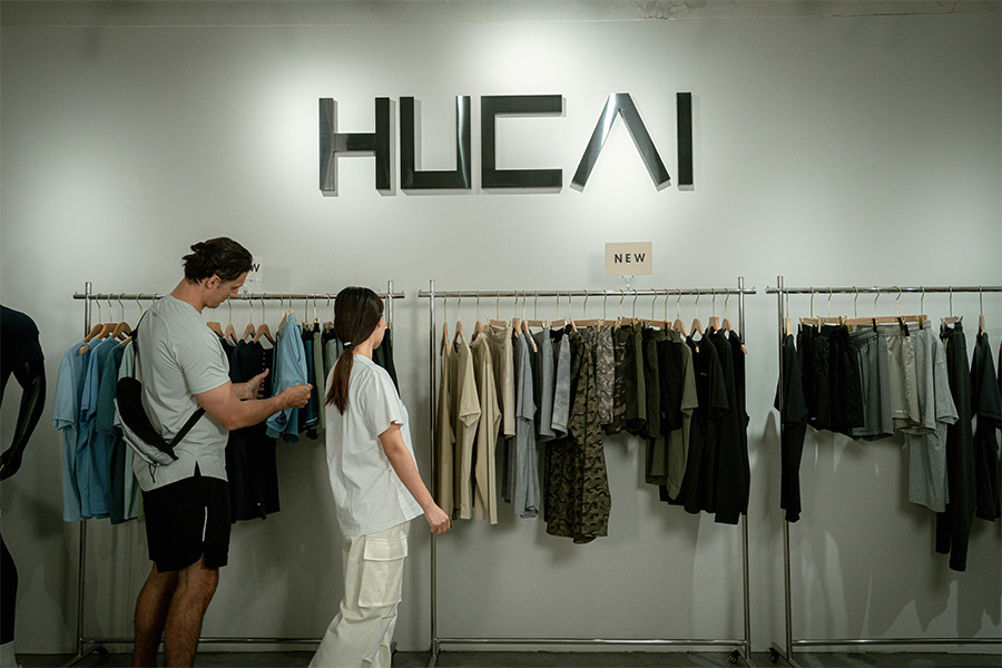 different colored fabric swatches displayed on shelf for activewear manufacturing selection