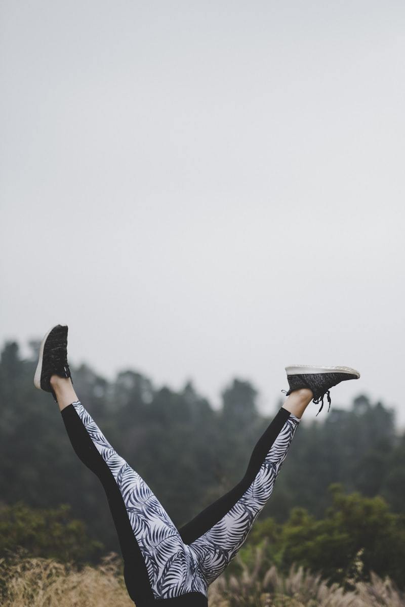 Woman in vibrant printed leggings showing an activewear print design