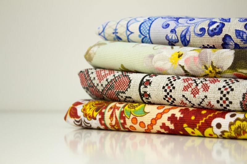 Stack of folded patterned fabrics in different prints and colorways