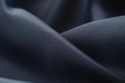 close-up of white activewear fabric showing surface handfeel and finish details for fabric specification review