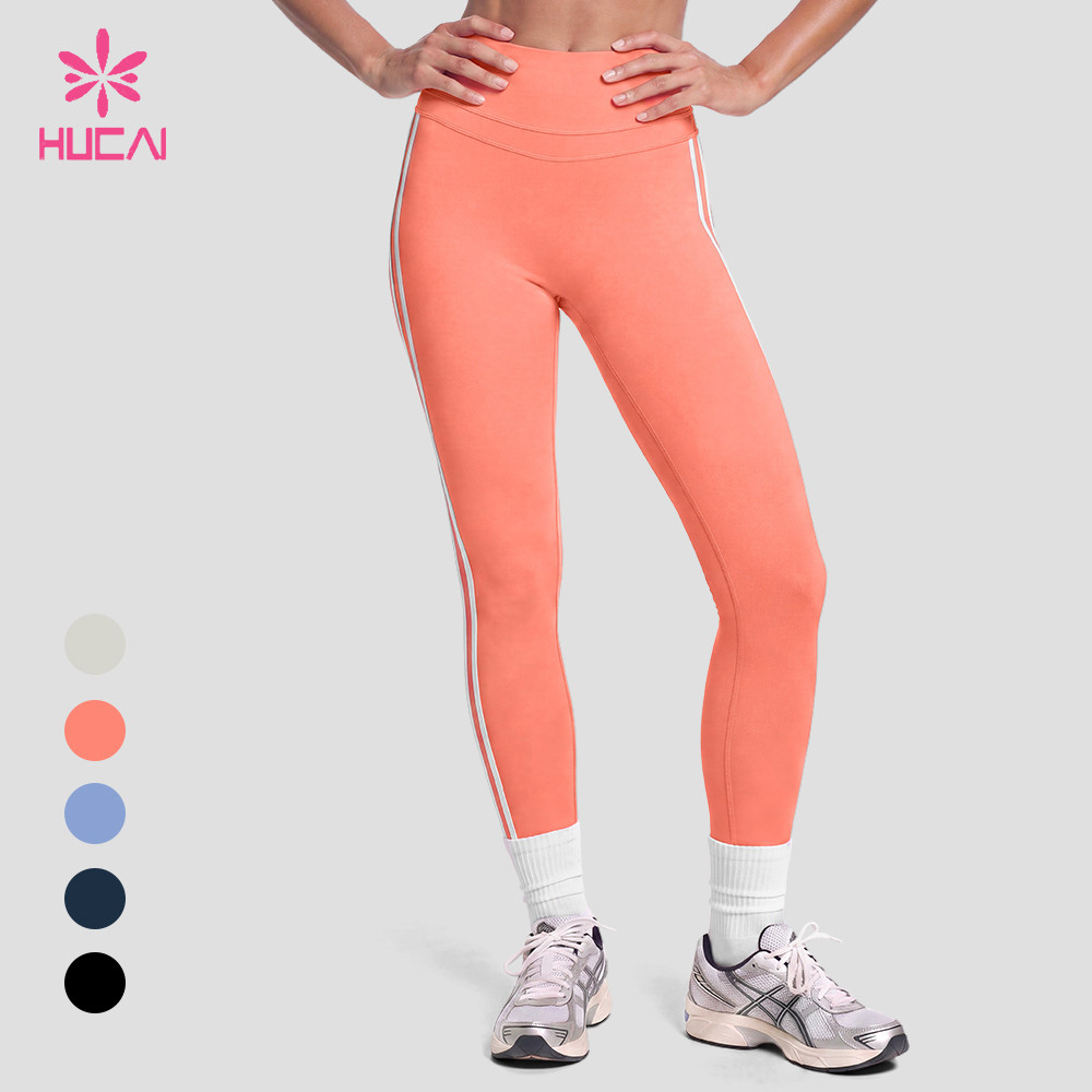 Custom coral full-length leggings front view with double contrast side stripe and custom colour swatches