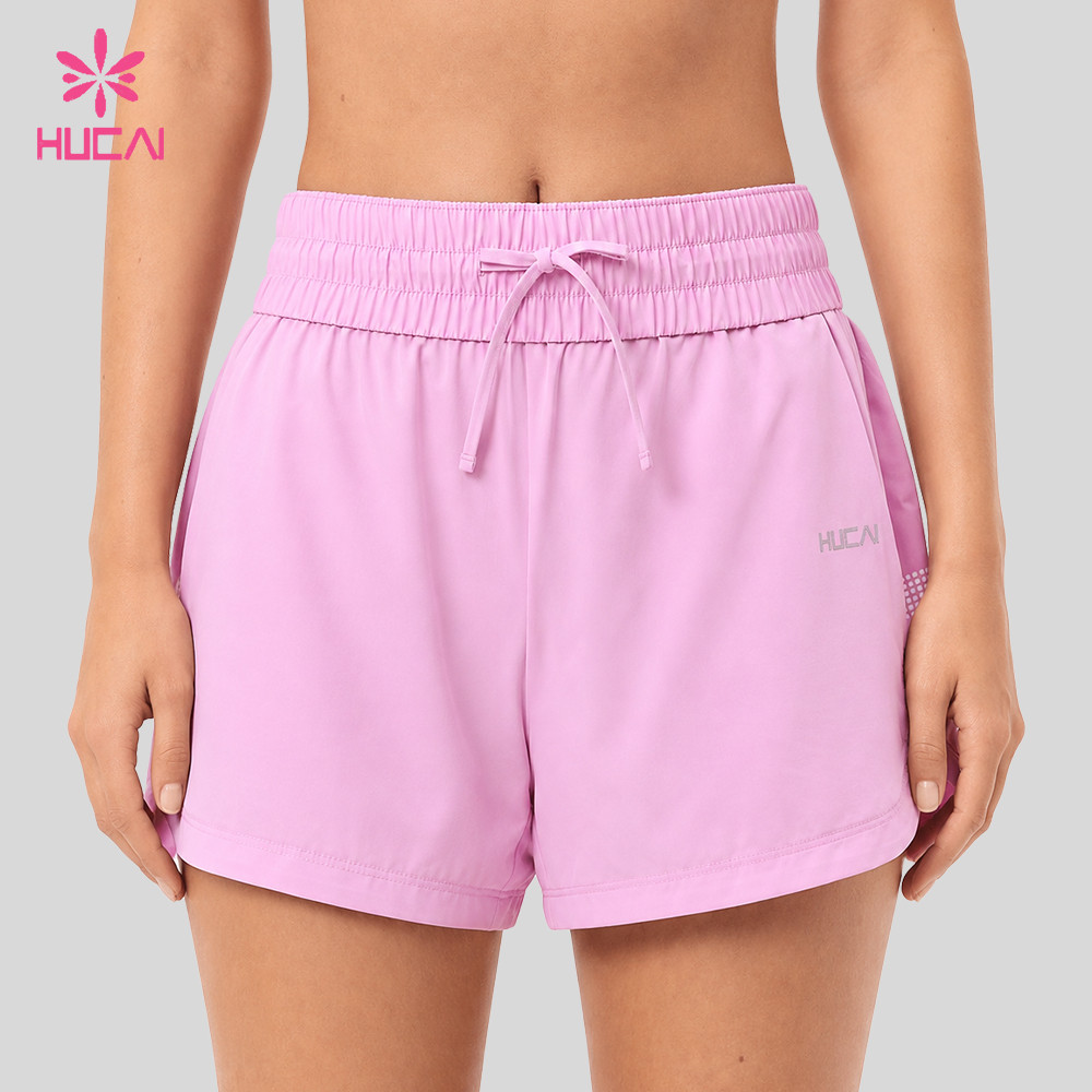 Front view of the drawstring waistband, hem curve and printed side stripe