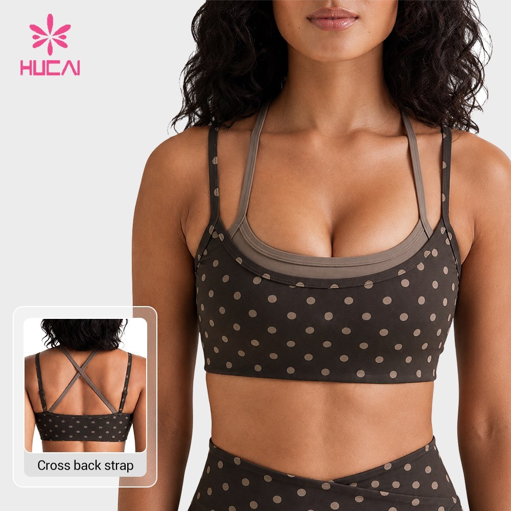 Custom polka dot sports bra front view showing the contrast lining and scooped neckline