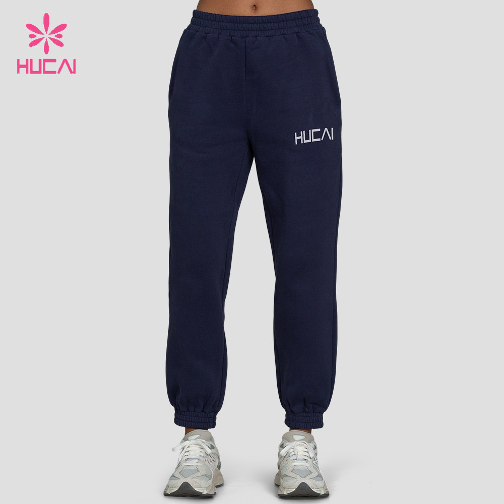 Full front view of the dark denim blue jogger sweatpant with cuffed leg openings