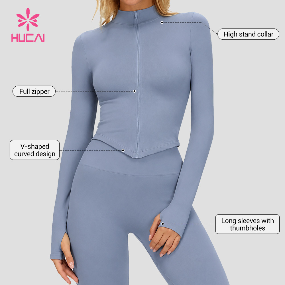 Reference view showing the high stand collar, full zipper and V-shaped curved hem