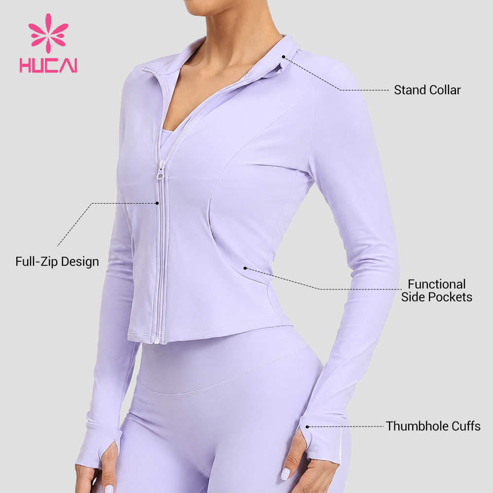 Reference view showing the stand collar, full-zip design, functional side pockets and thumbhole cuffs