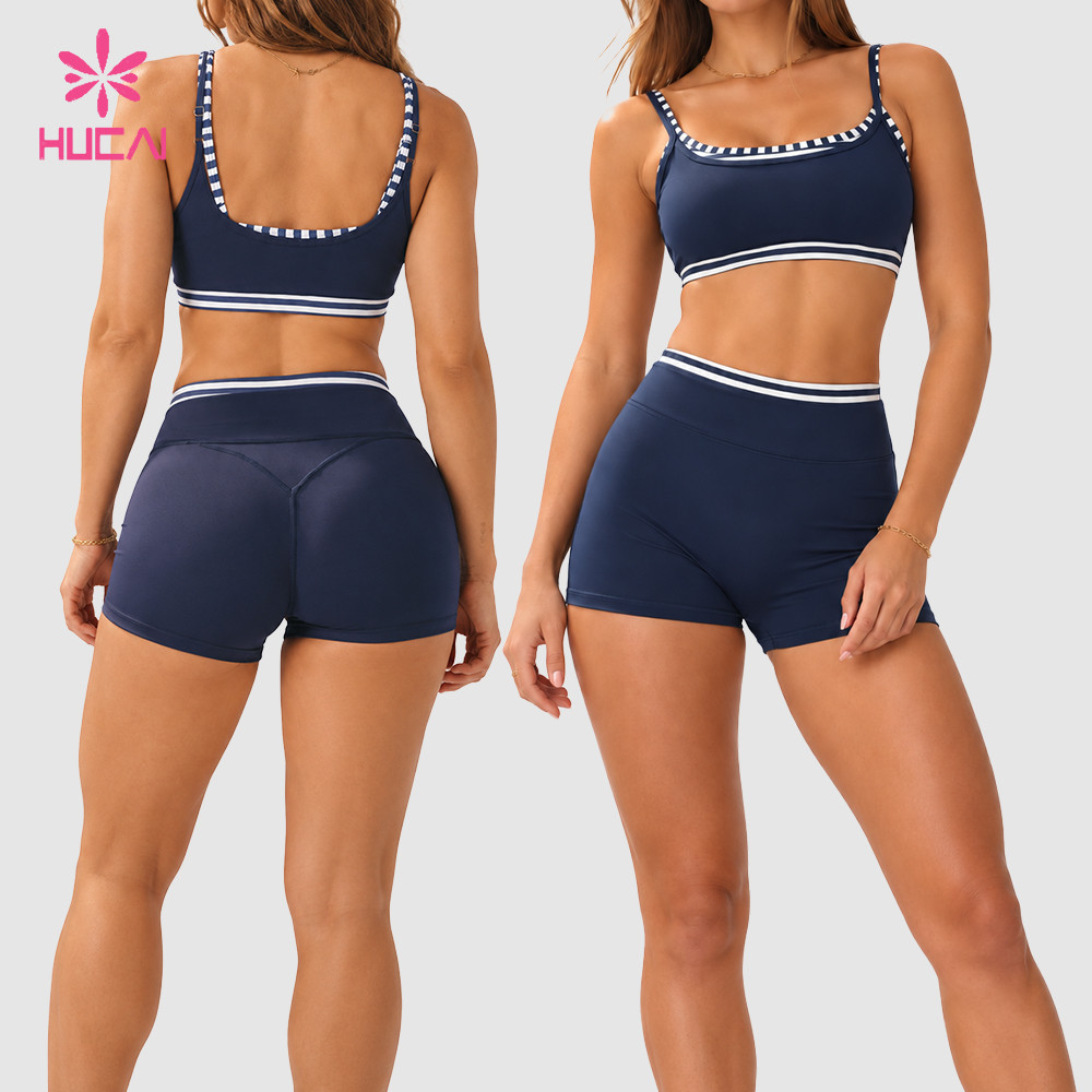 Back and front views of a custom navy sports bra and biker shorts set