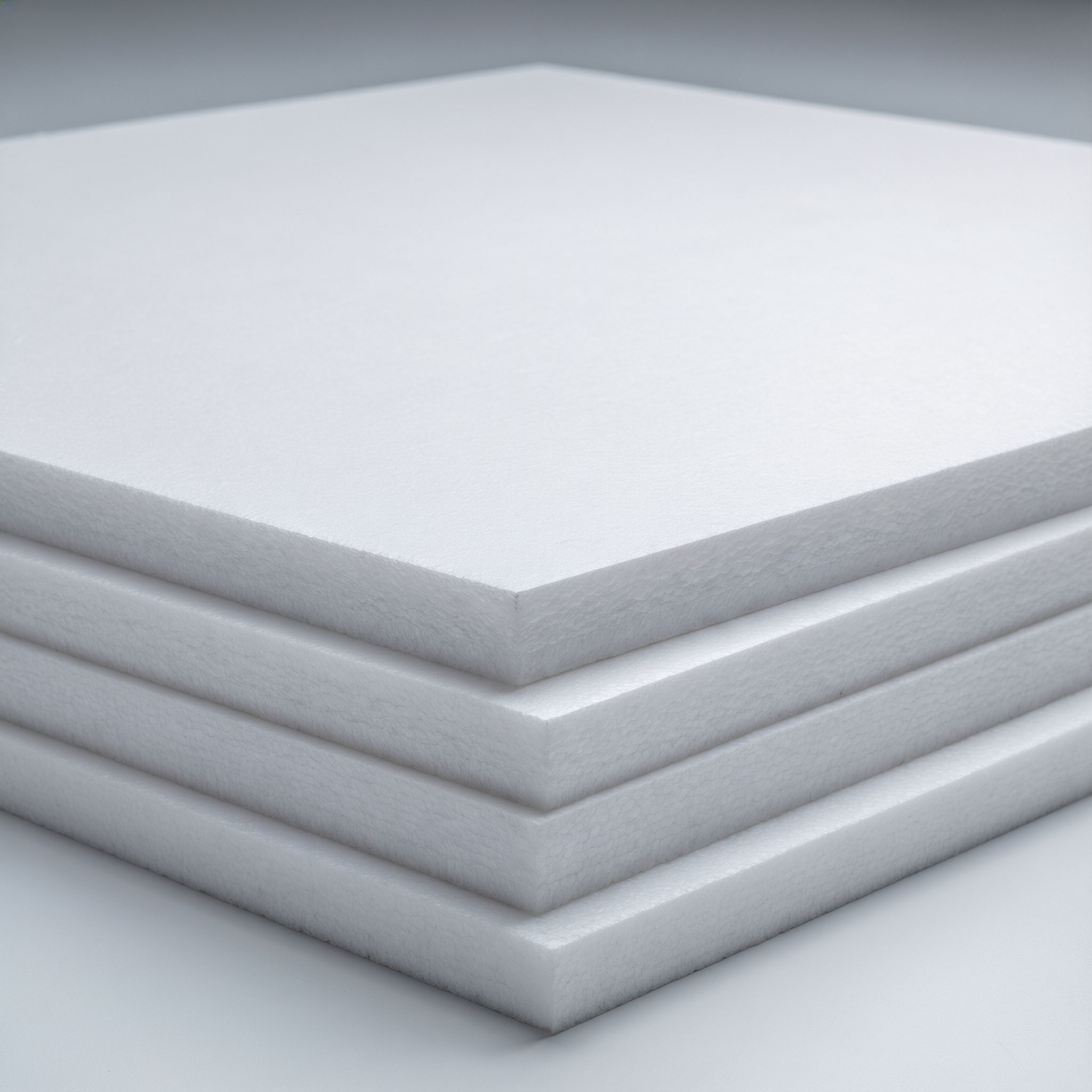 PVC foam board sheets stacked with visible foam core cross-section