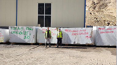 Freshly extracted Tasso White marble blocks marked with dimensions in the quarry yard