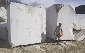 Tasso White marble blocks stacked in the quarry yard