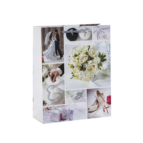 La foto imprime una boda brillante y favorece las bolsas de regalo con 4 diseños surtidos en Tongle Packing