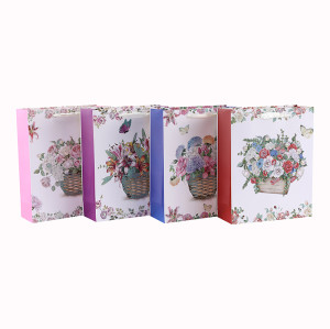 Bolsa de regalo de papel con mango de cinta blanca y diseño de flores de cartón blanco con 4 diseños surtidos en embalaje de llave