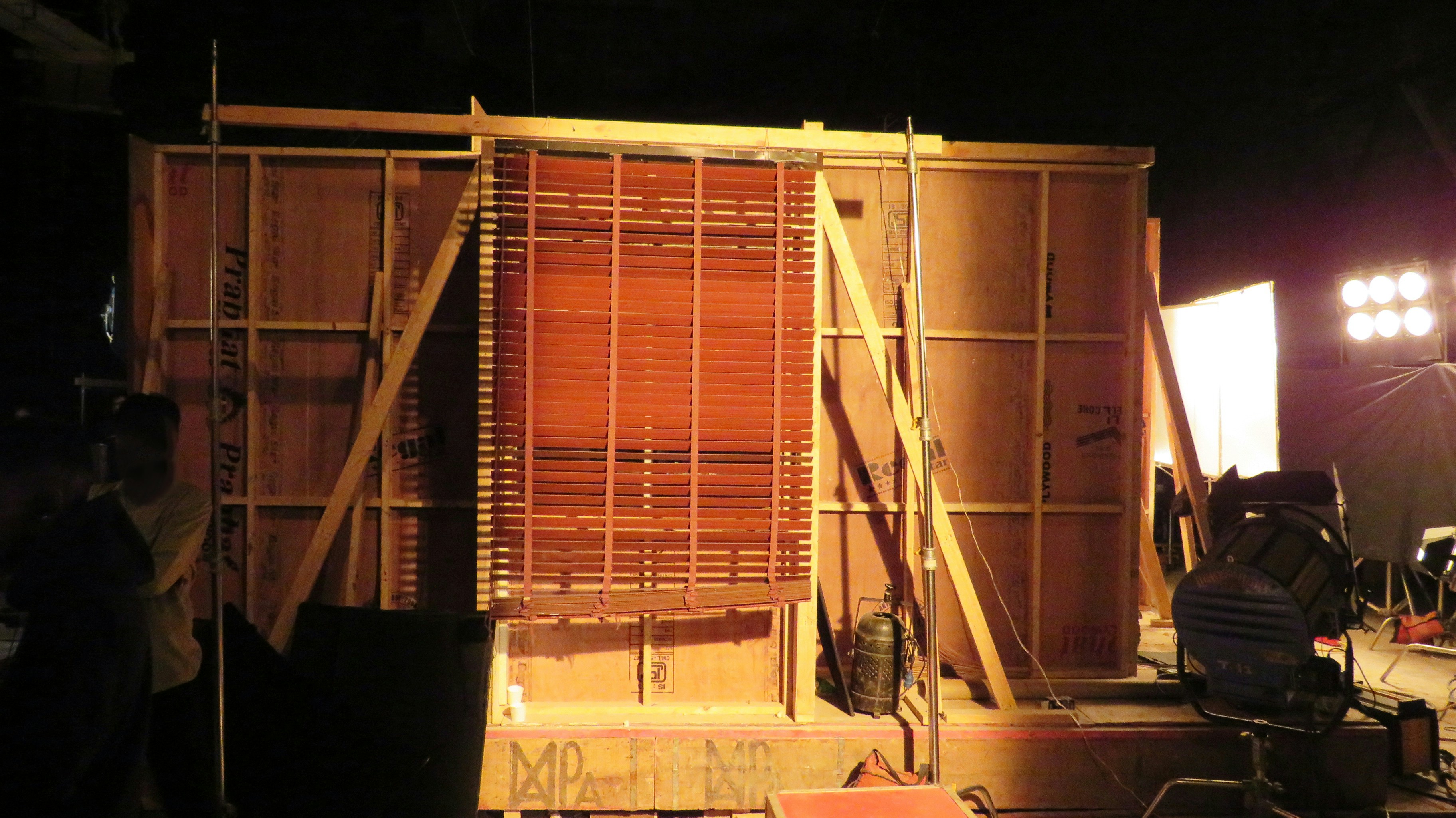 Heavy-duty shipping crate for stage equipment A large wooden shipping crate designed for heavy equipment, with visible reinforcement.