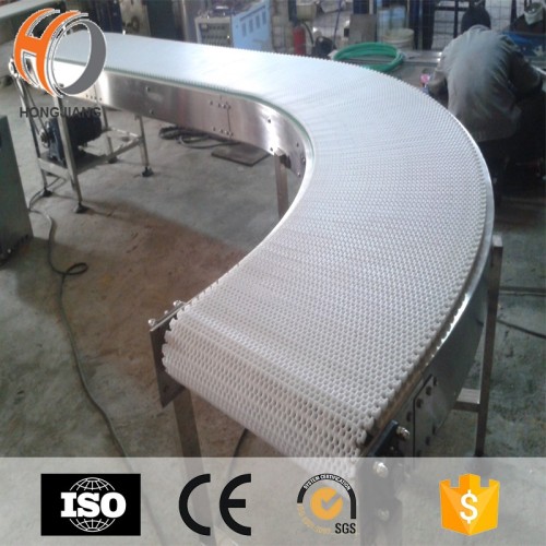 Curve conveyor system with modular belt for packing machine