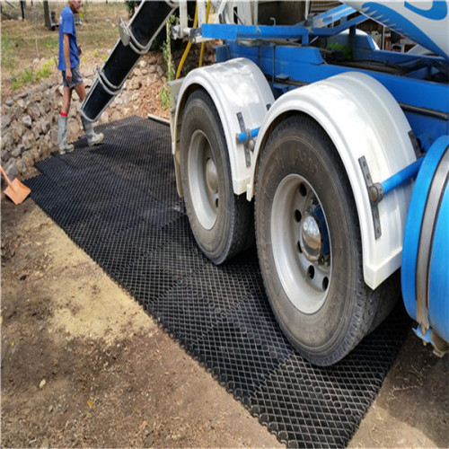 Plastic grids for planting grass muddy road drive road used