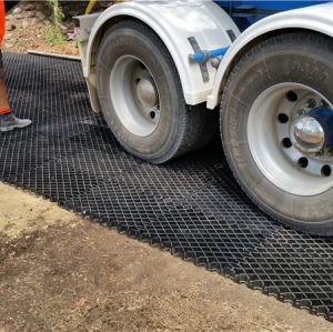Plastic grids for planting grass muddy road drive road used