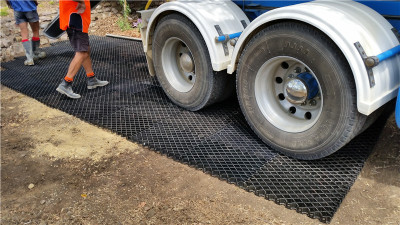 Plastic grids for planting grass muddy road drive road used