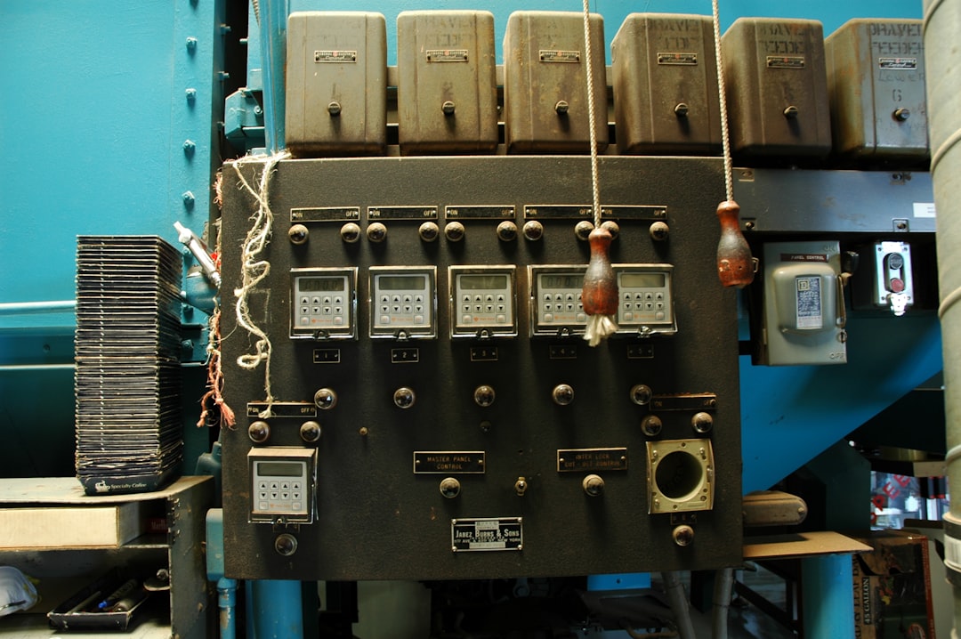 Image: Close-up of a PLC control panel with a touch screen for a roll forming machine.