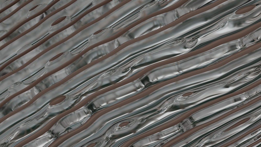 Close-up of metal coil feeding into a roll former