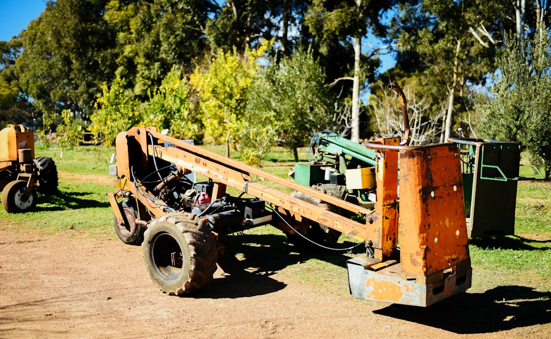 A portable standing seam rolling machine on a construction site trailer.