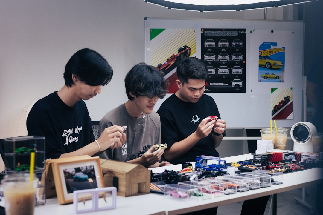 A team of engineers reviewing production data from a new standing seam machine