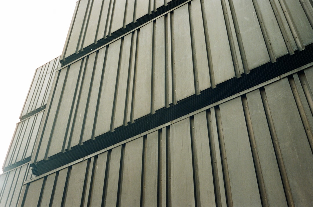 Curved standing seam panels on an architectural building