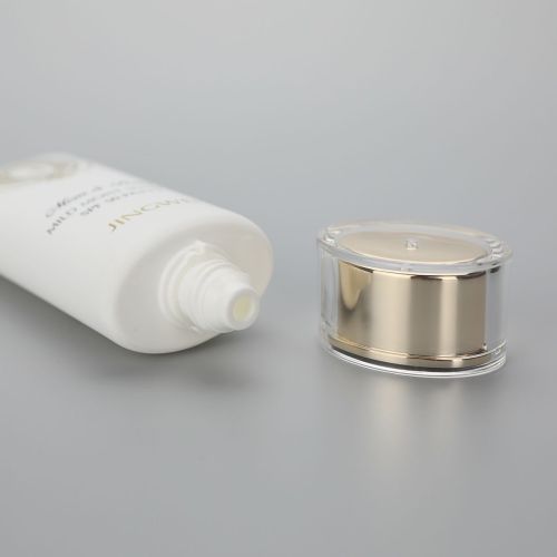 45mm Oval white 100g/3.5oz  plastic sunscreen cosmetic tube with golden pumps and acrylic cap