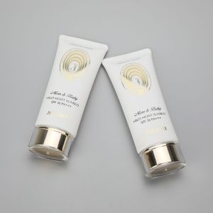 45mm Oval white 100g/3.5oz  plastic sunscreen cosmetic tube with golden pumps and acrylic cap