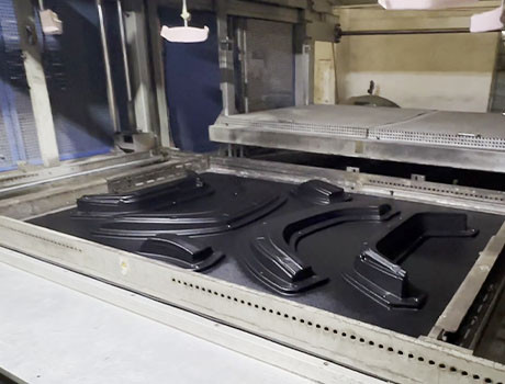 Wheel arch trim vacuum forming