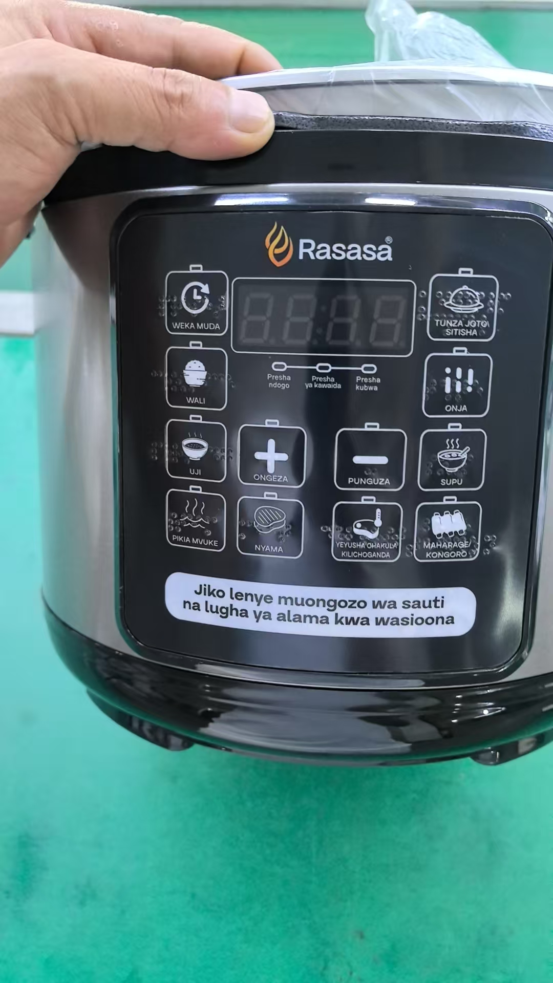 Swahili-language pressure cooker control panel with tactile dot markings