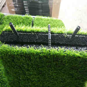Artificial grass with rubber safty tiles