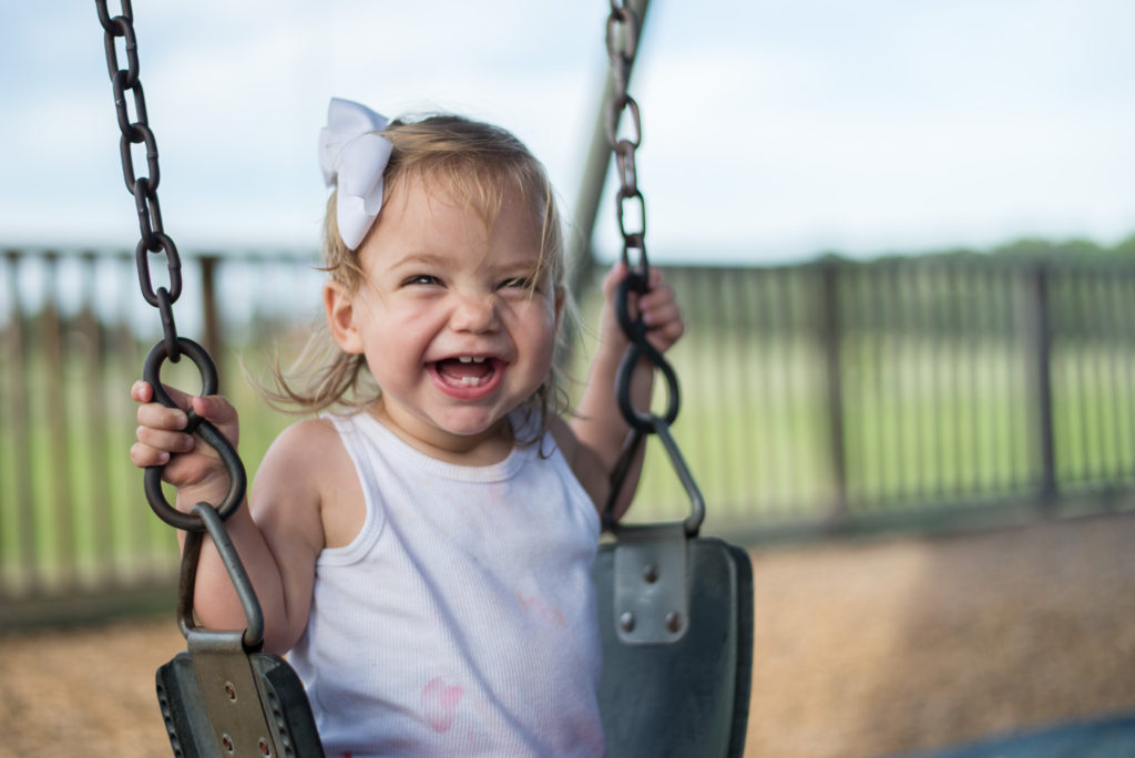 the specific benefits of children playing swings