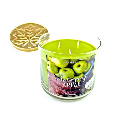 Natural three wick fruit flavour soy wax scented candles placed in colorful glass jars