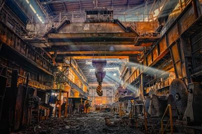 Large industrial steel plant interior with production equipment