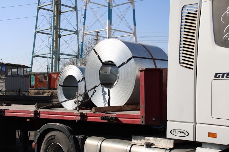 Transportation of aluminum coils on truck for delivery - MESCO Steel